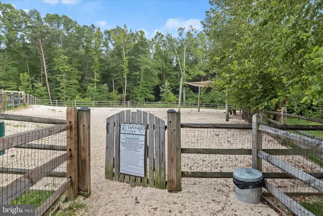 a view of a lake with houses in the back