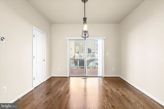 a kitchen with stainless steel appliances granite countertop a stove microwave and refrigerator