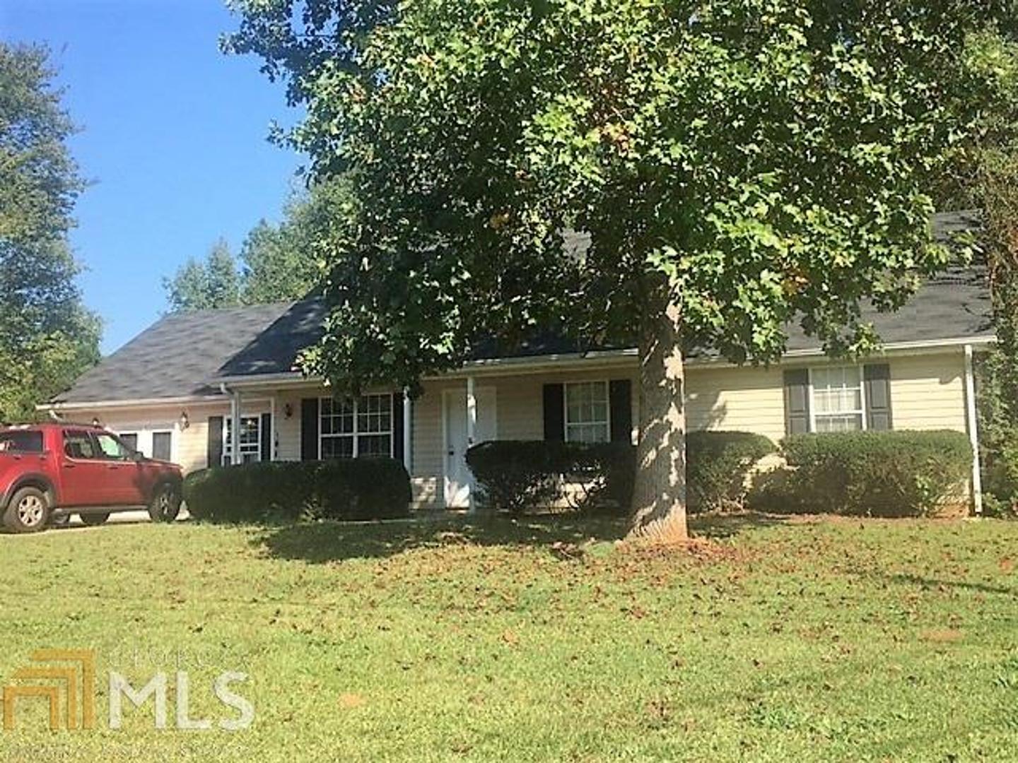 137 Pebble Creek Road Jackson, GA 30233 - Photo 1 of 1 front view of a house with a yard