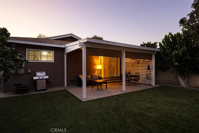 a patio with table and chairs