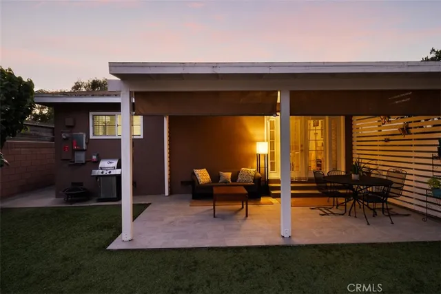 a view of a backyard with sitting area and slide