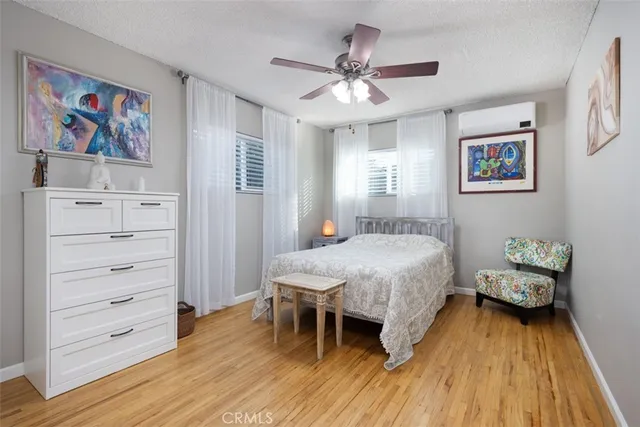 a spacious bedroom with a bed and a table