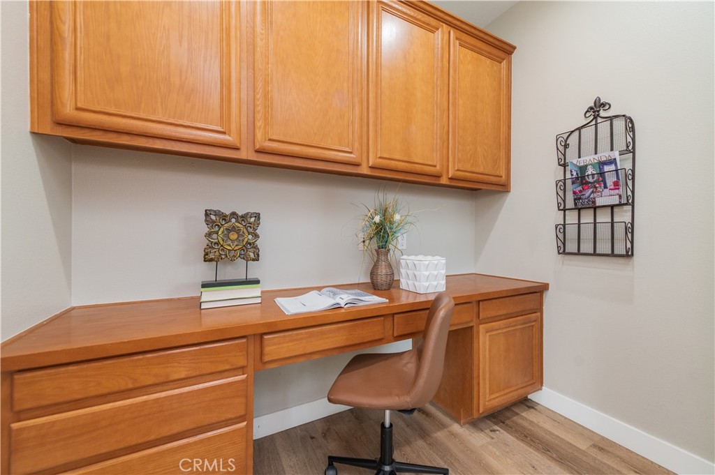 14236 Pointer Loop Eastvale, CA 92880 - Photo 12 of 38 a room with workbench and window