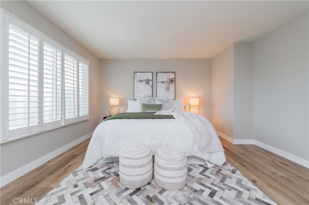 14236 Pointer Loop Eastvale, CA 92880 - Photo 27 of 38 a bedroom with a bed and a window