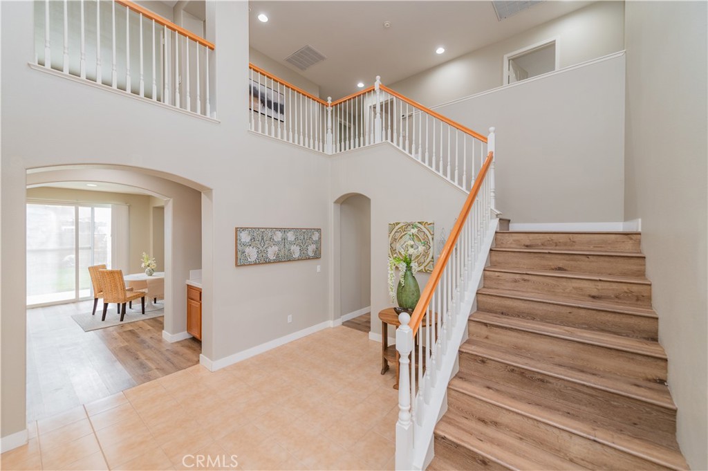14236 Pointer Loop Eastvale, CA 92880 - Photo 5 of 38 a view of entryway and hall with wooden floor