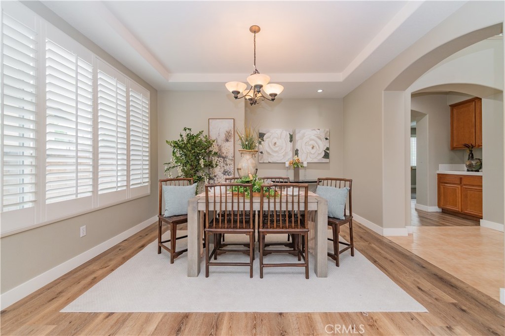 14236 Pointer Loop Eastvale, CA 92880 - Photo 6 of 38 a dining room with furniture and window