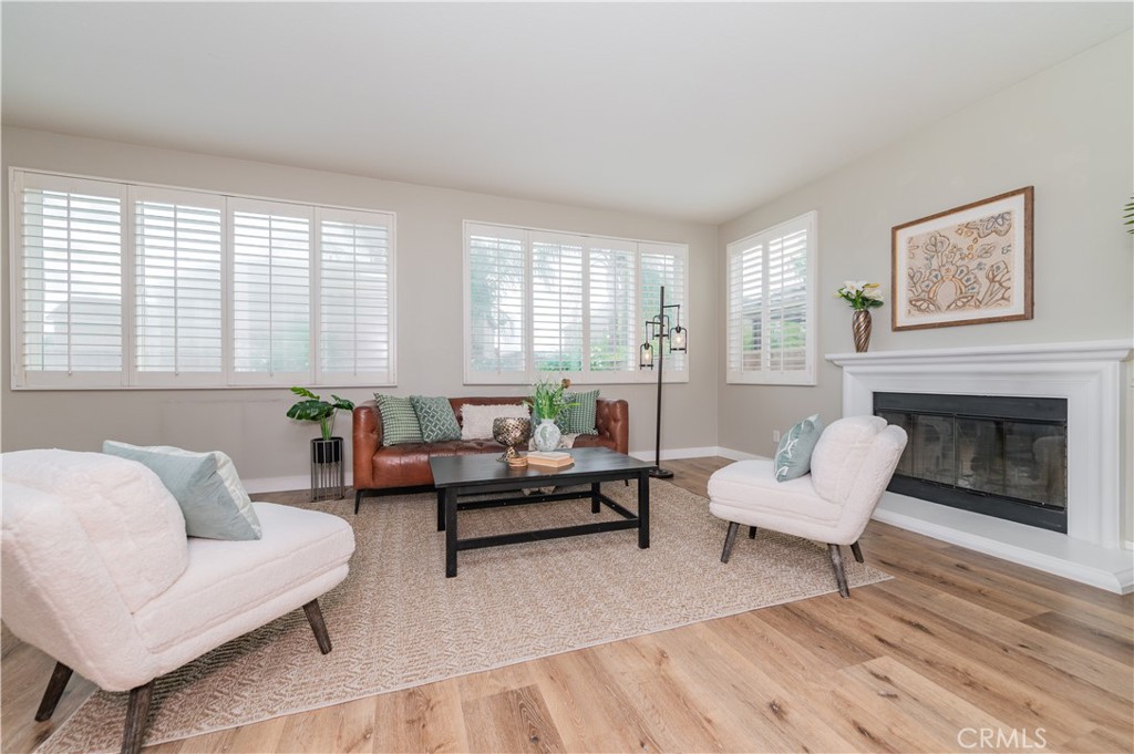 14236 Pointer Loop Eastvale, CA 92880 - Photo 10 of 38 a living room with furniture and a fireplace
