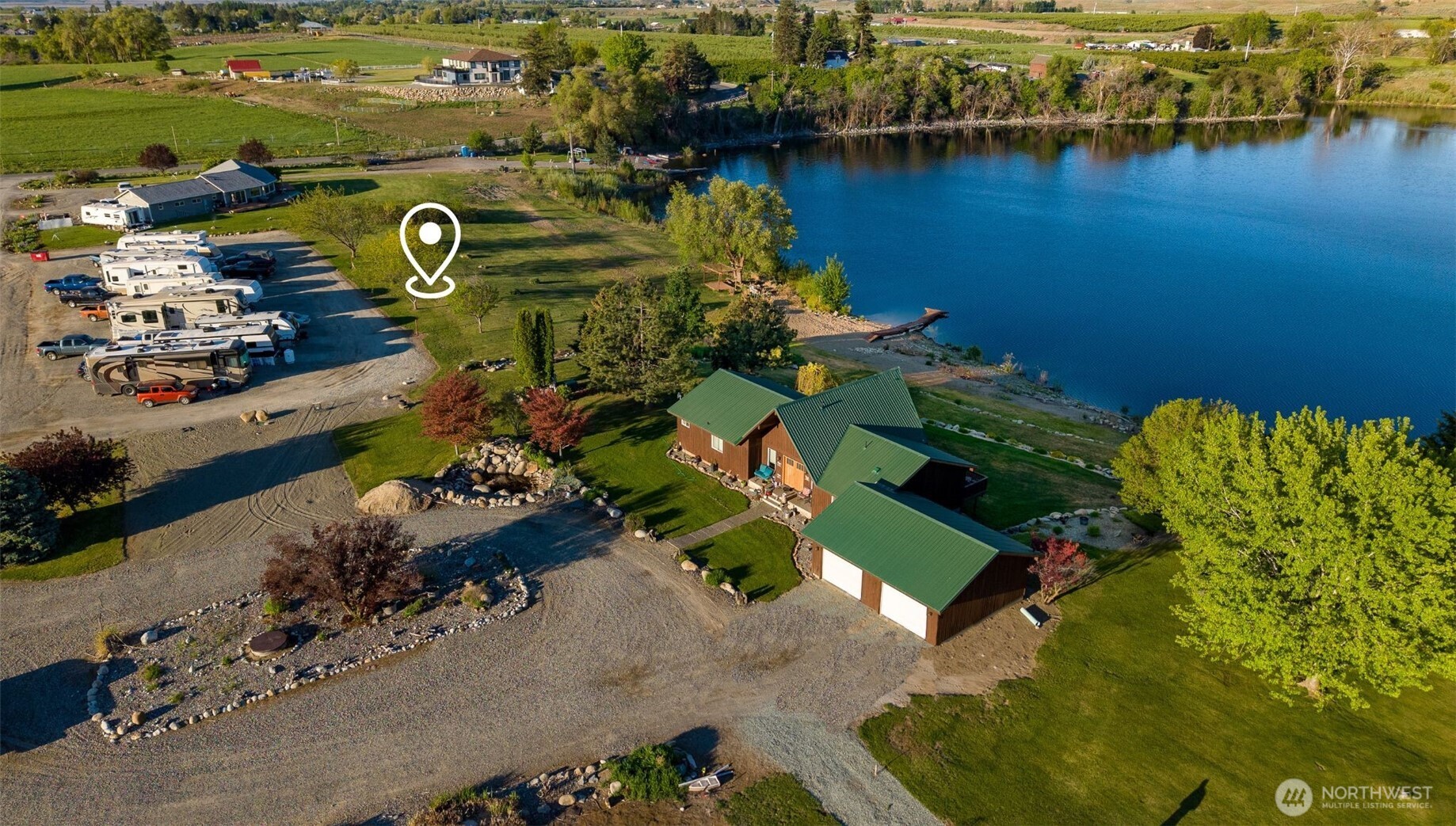 5 Sunset Lakes Road Riverside, WA 98849 - Photo 4 of 7 an aerial view of a house with a lake view