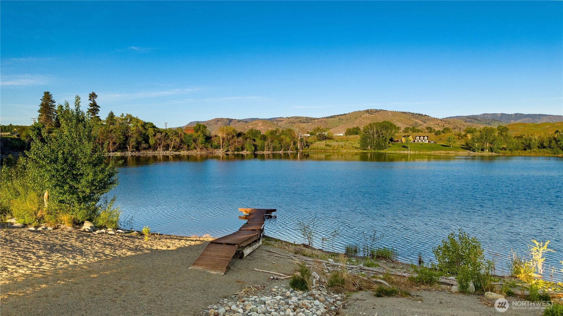 5 Sunset Lakes Road Riverside, WA 98849 - Photo 6 of 7 a view of a lake with a mountain