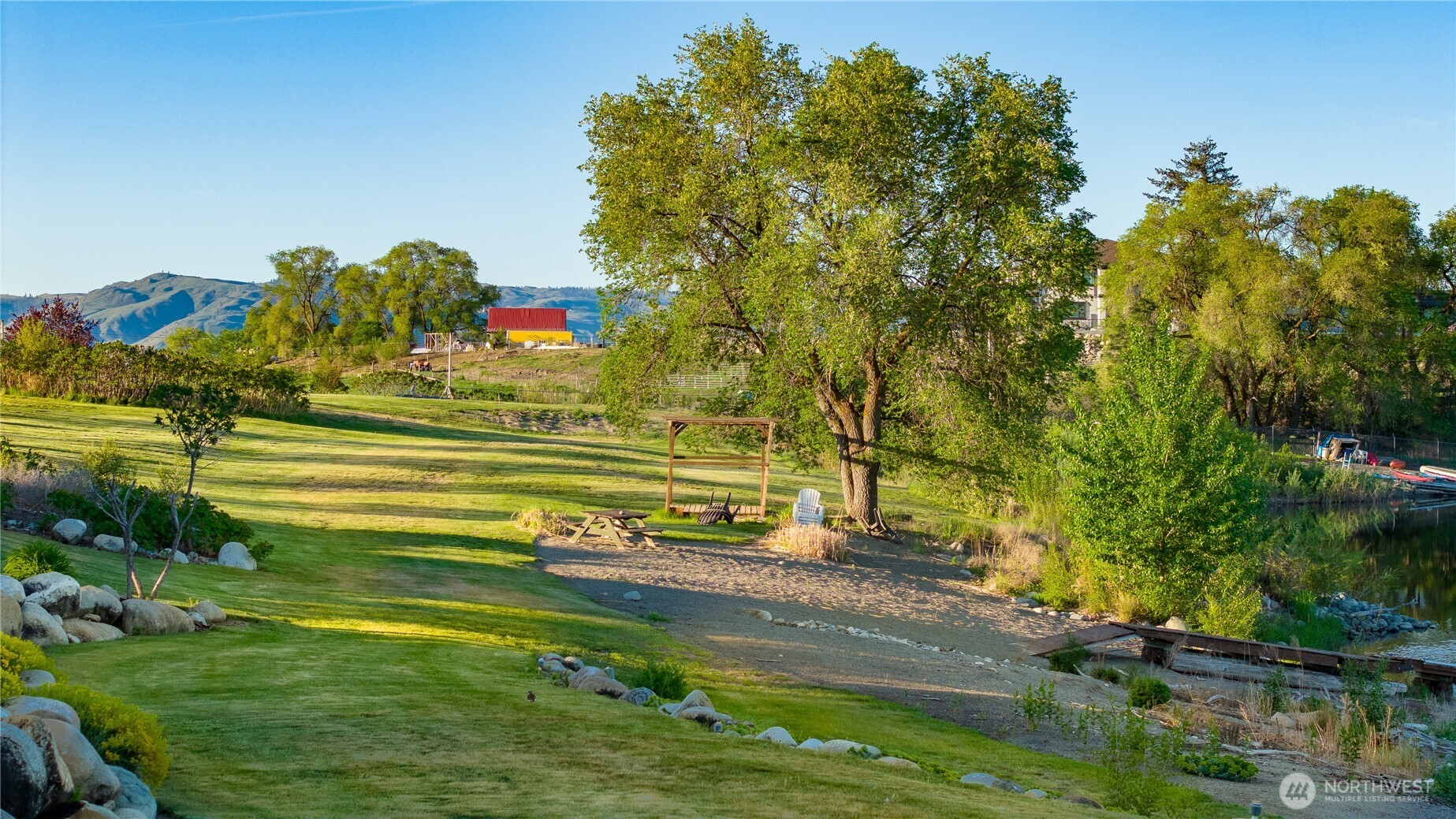 5 Sunset Lakes Road Riverside, WA 98849 - Photo 7 of 7 a view of a golf course with a lake