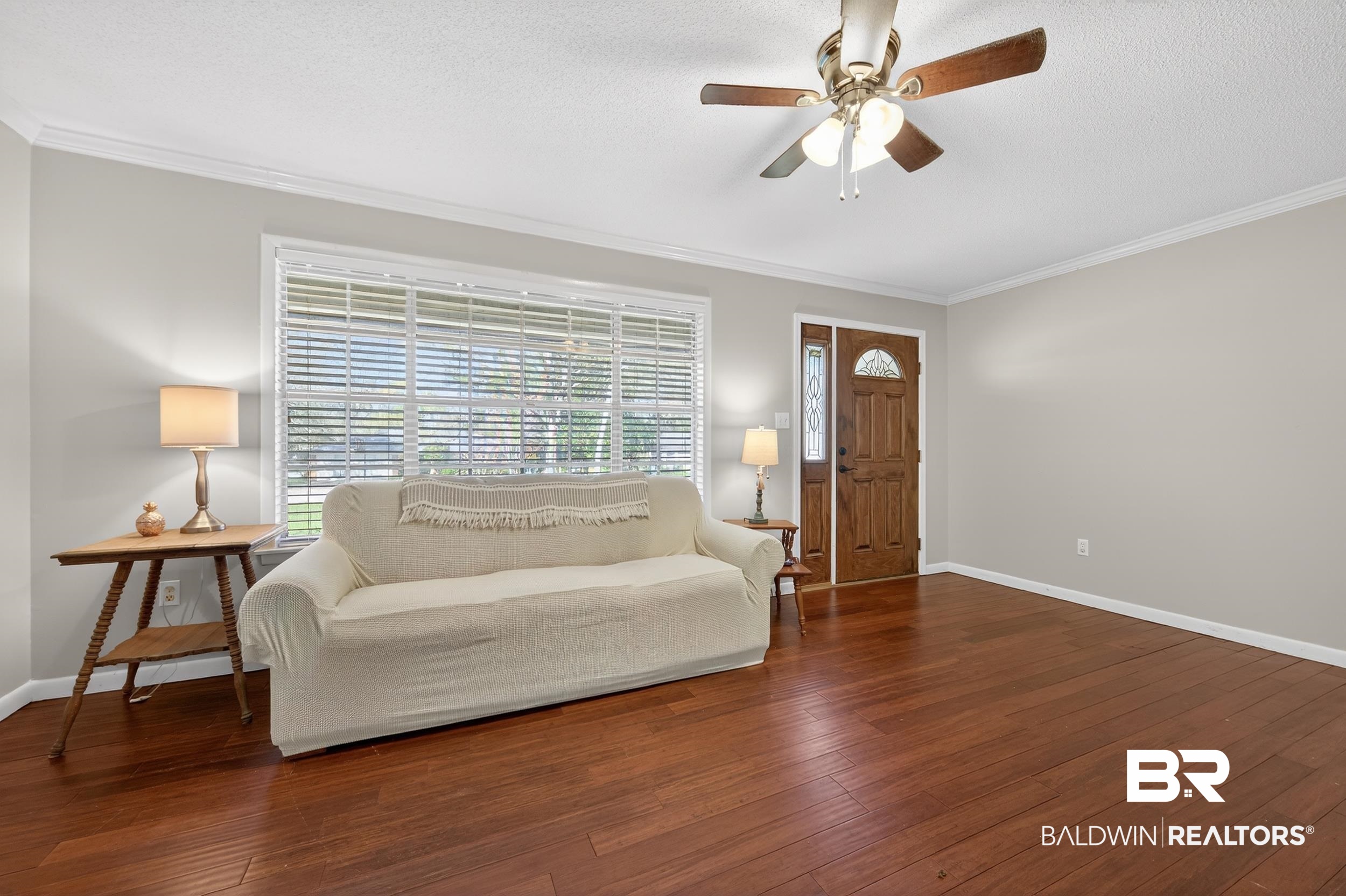 46006 Pecan Lane Bay Minette, AL 36507 - Photo 22 of 40 Sitting room with a textured ceiling, a ceiling fan, dark wood-style floors, and crown molding