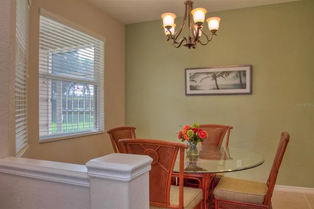 a bedroom with a bed and a chair