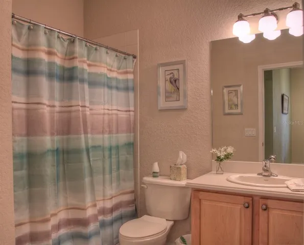 a bedroom with bed and window