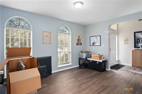 a living room with furniture and a window