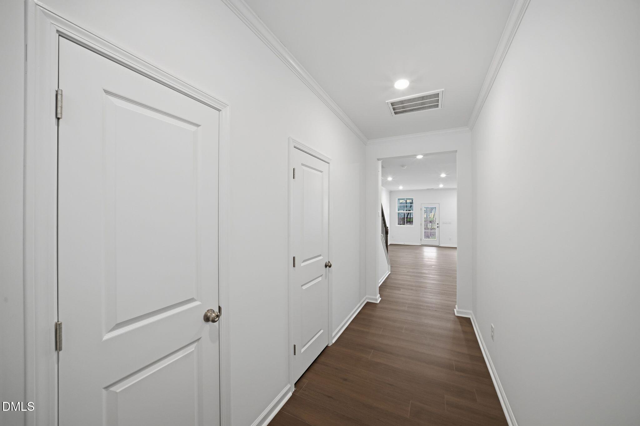 123 Tree Moss Court Rolesville, NC 27571 - Photo 15 of 33 a hallway with wooden floor