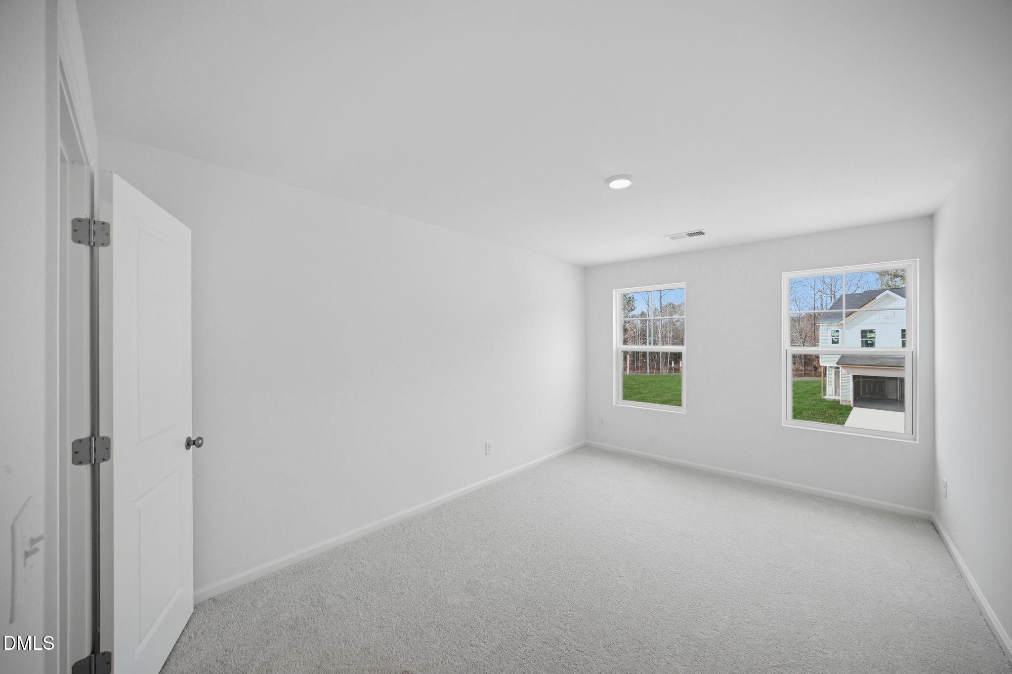 123 Tree Moss Court Rolesville, NC 27571 - Photo 21 of 33 a view of an empty room with a window