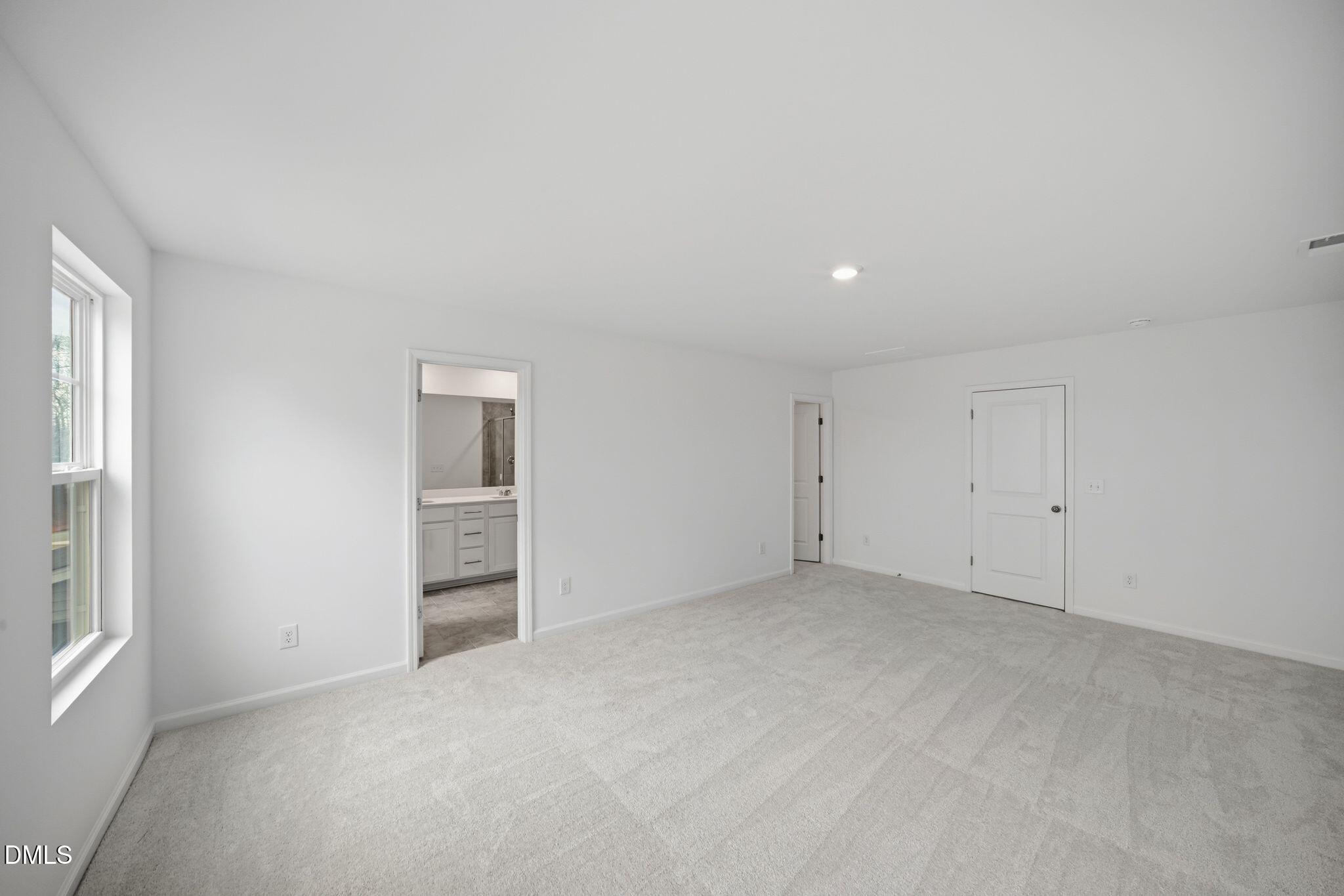 123 Tree Moss Court Rolesville, NC 27571 - Photo 25 of 33 an empty room with windows and closet