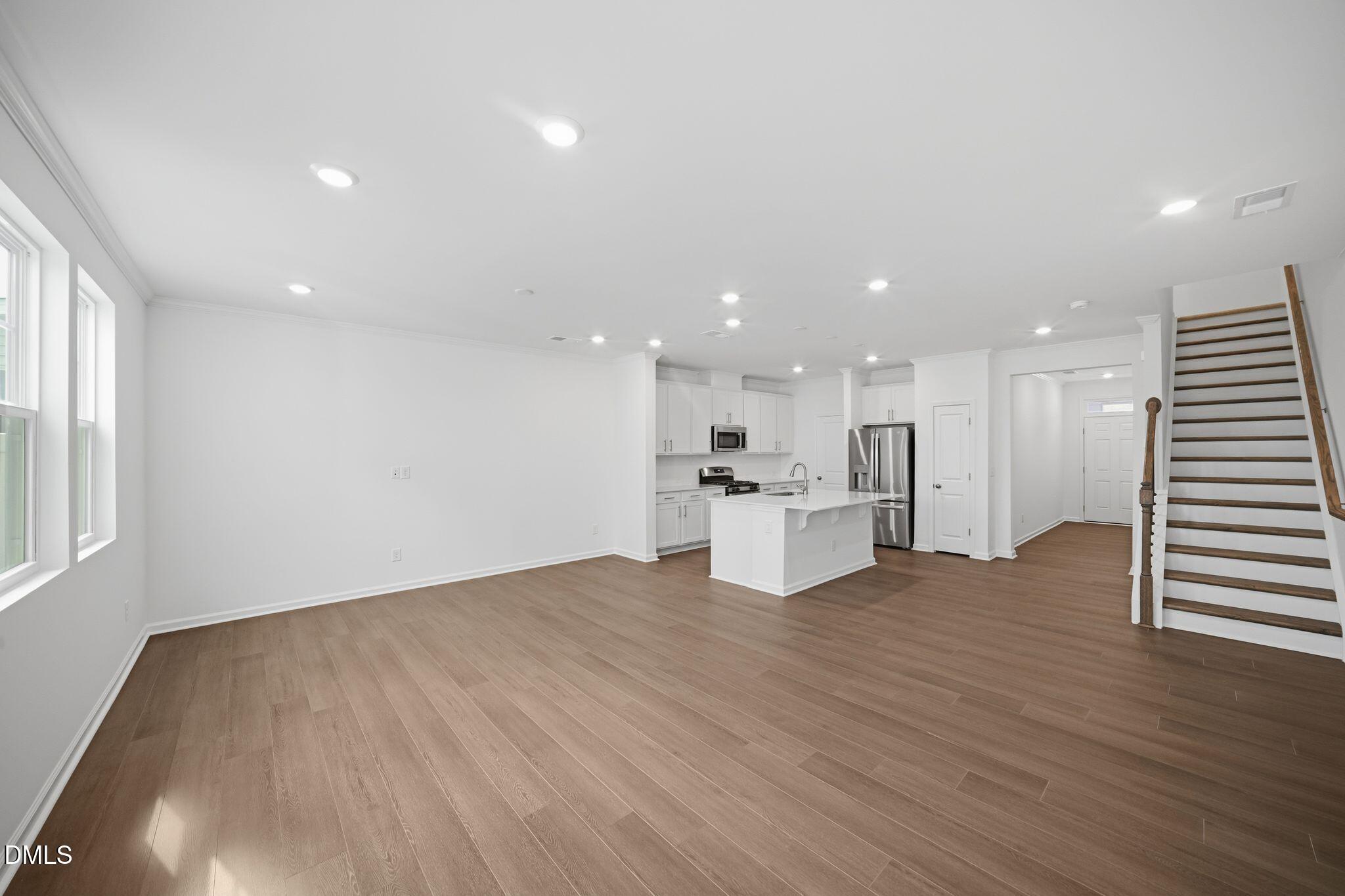 123 Tree Moss Court Rolesville, NC 27571 - Photo 5 of 33 a view of a kitchen with a sink and a microwave