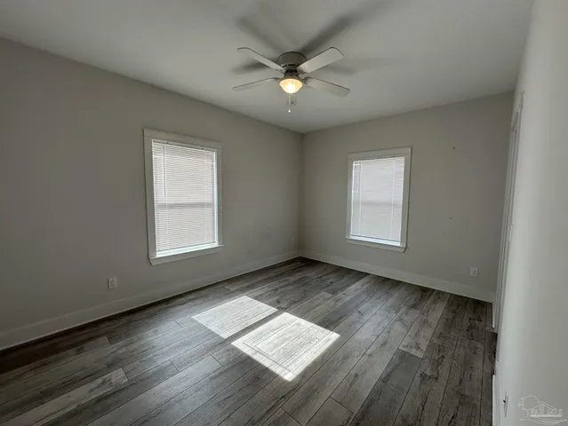 a bathroom with a double vanity sink and mirror