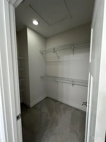 a bathroom with a tub sink shower and mirror