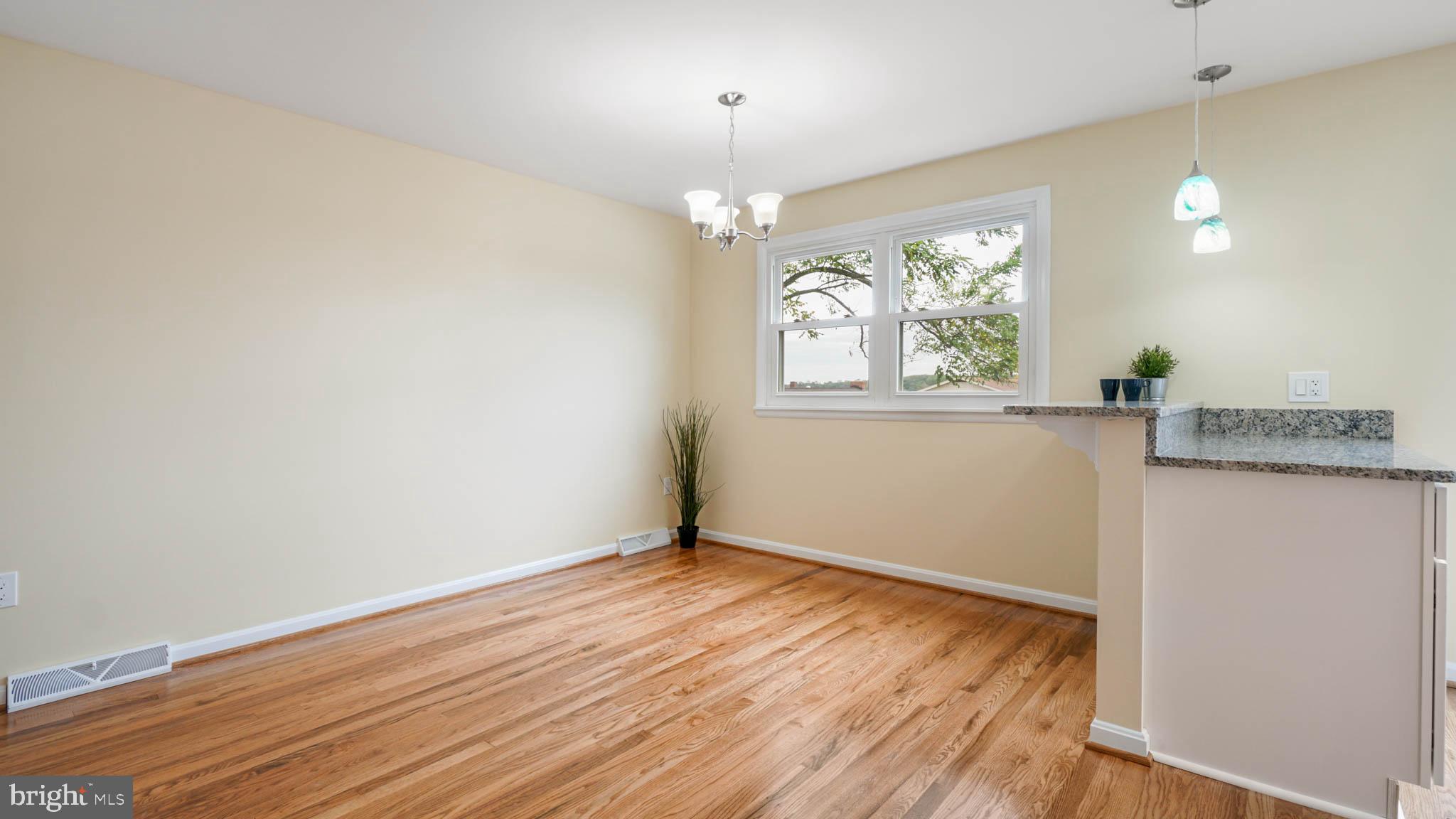 220 Atlanta Road Pasadena, MD 21122 - Photo 11 of 30 Dining area with sitting at island