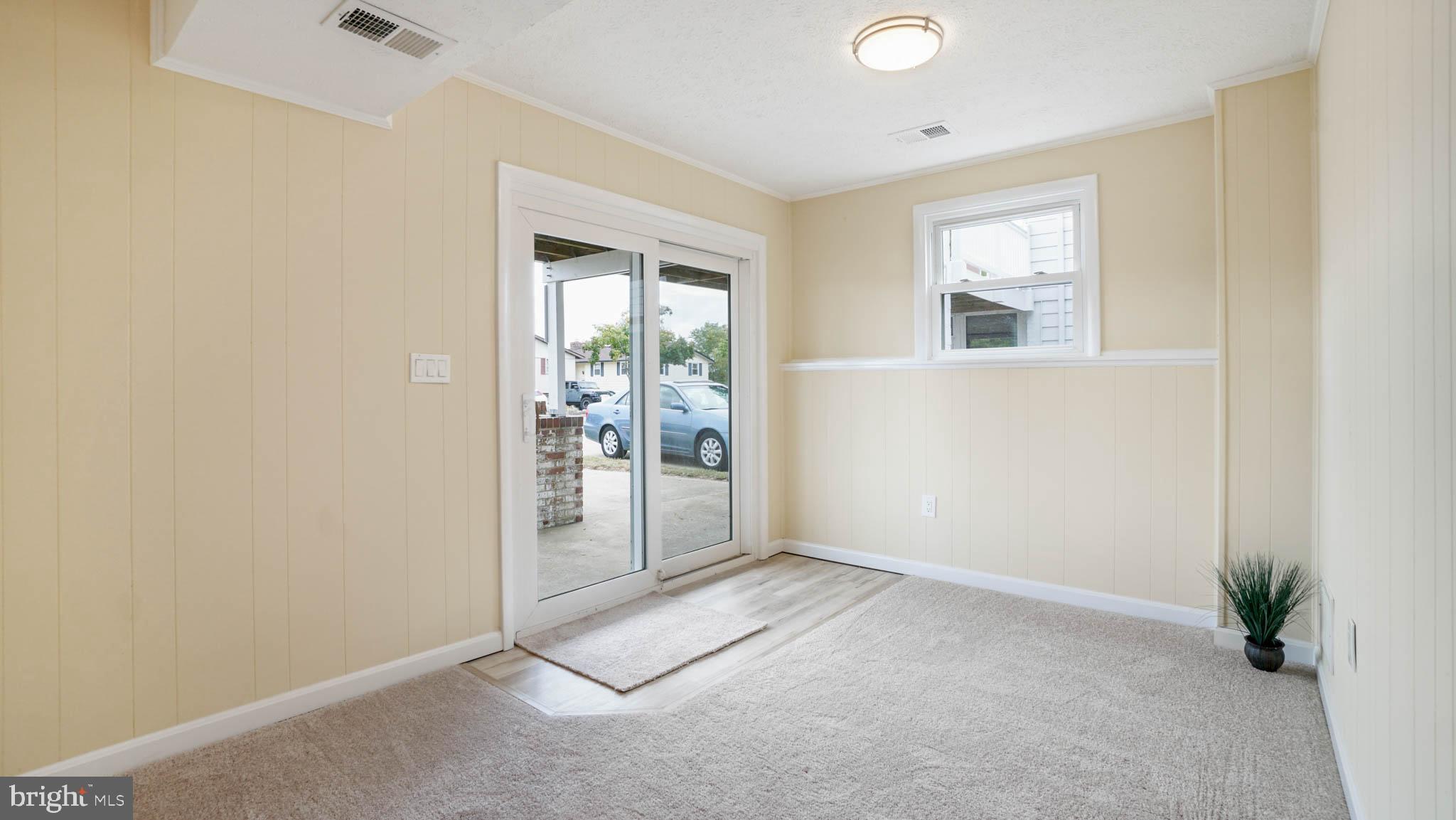 220 Atlanta Road Pasadena, MD 21122 - Photo 23 of 30 Basement with sliders to porch