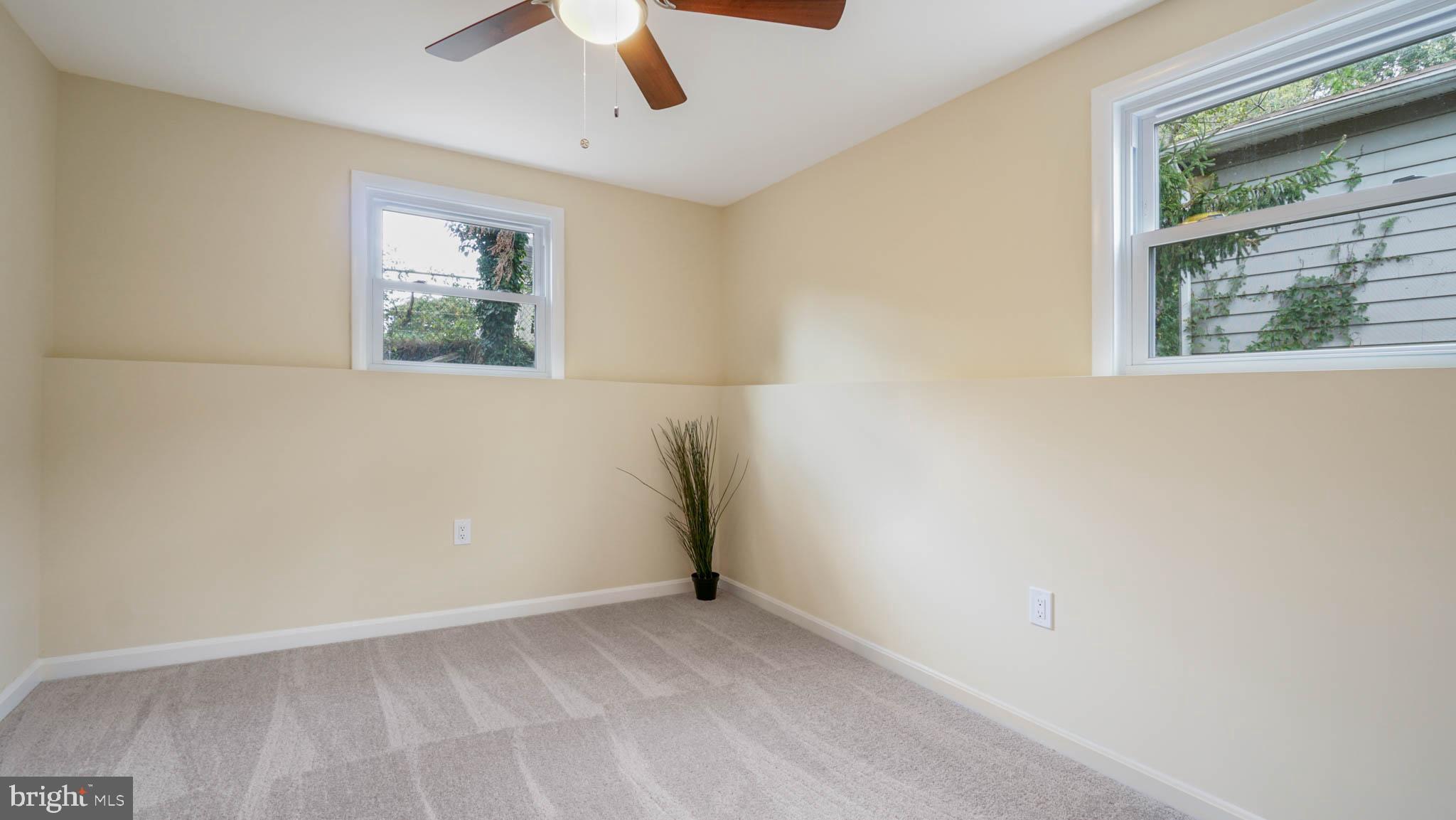 220 Atlanta Road Pasadena, MD 21122 - Photo 28 of 30 Fourth bedroom with carpet, windows and closet.