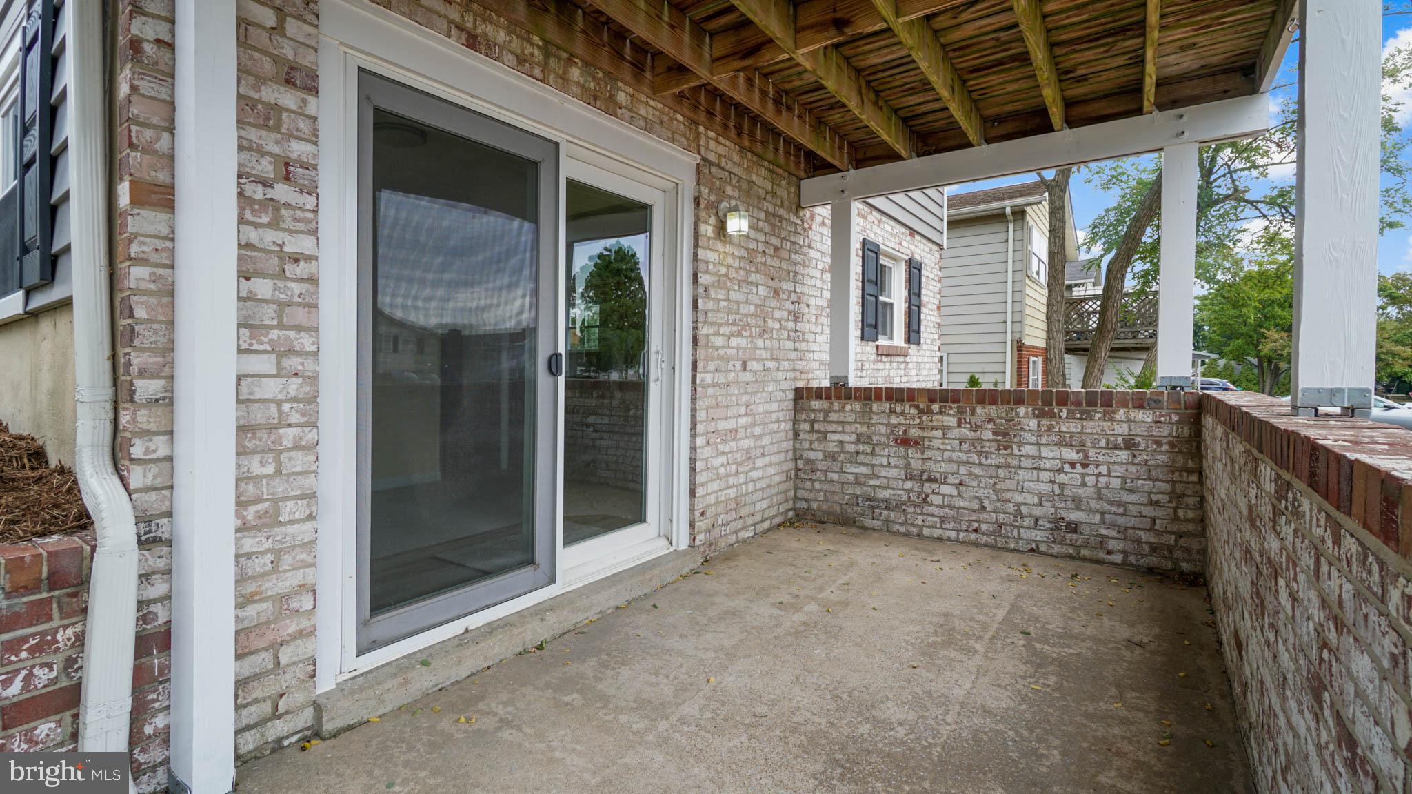 220 Atlanta Road Pasadena, MD 21122 - Photo 5 of 30 Porch outside family room with deck above