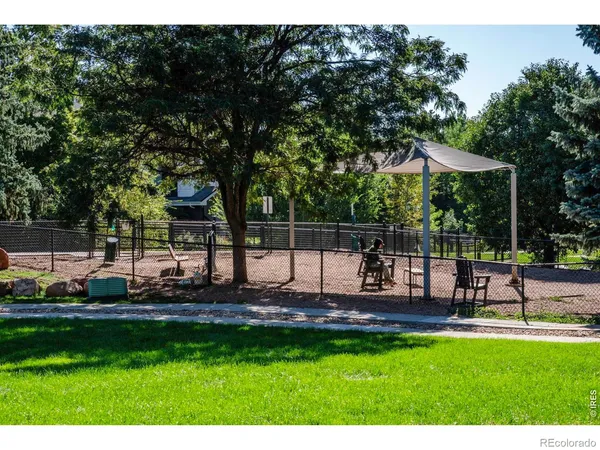 a view of a lake with houses in the back