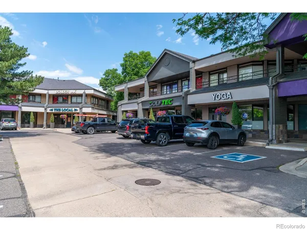 a store with outdoor seating area and garage