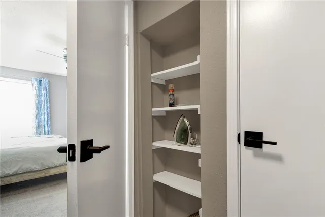 a view of a bedroom from a hallway