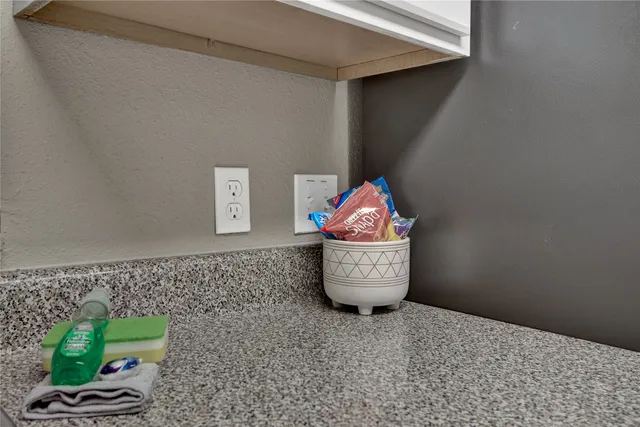 a wooden floor with a vase of flowers on it