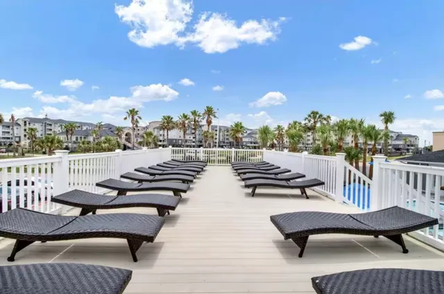 an aerial view of a house with garden space and street view