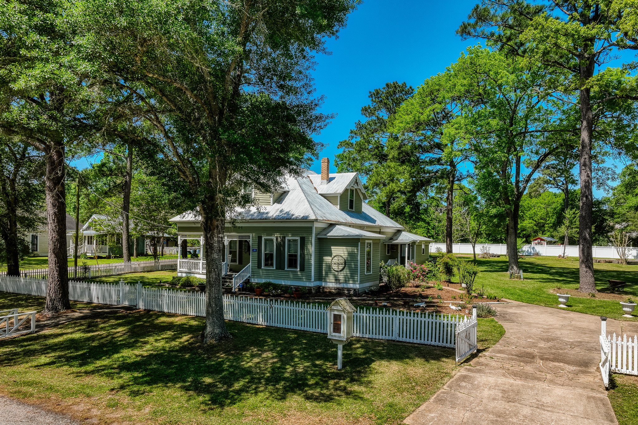 a front view of a house with a yard table and chairs