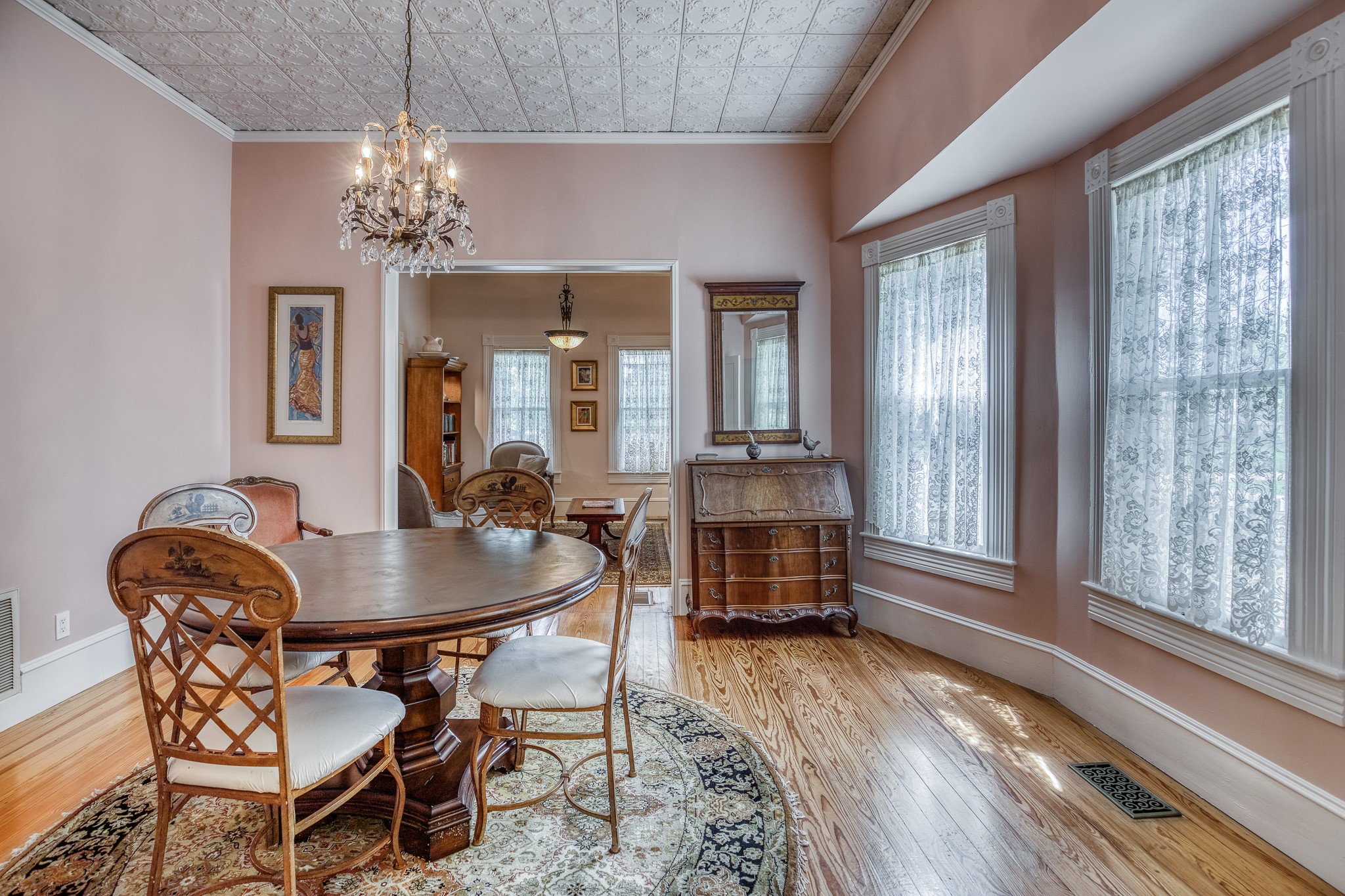 235 Hickory Road New Ulm, TX 78950 - Photo 14 of 43 a dining room with furniture a chandelier and wooden floor