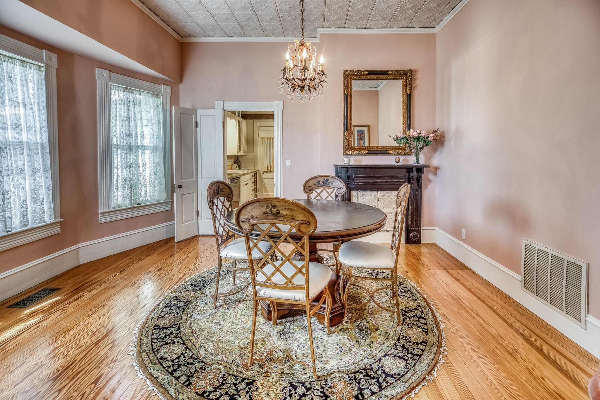 235 Hickory Road New Ulm, TX 78950 - Photo 15 of 43 a dining room with wooden floor a chandelier a wooden table and chairs