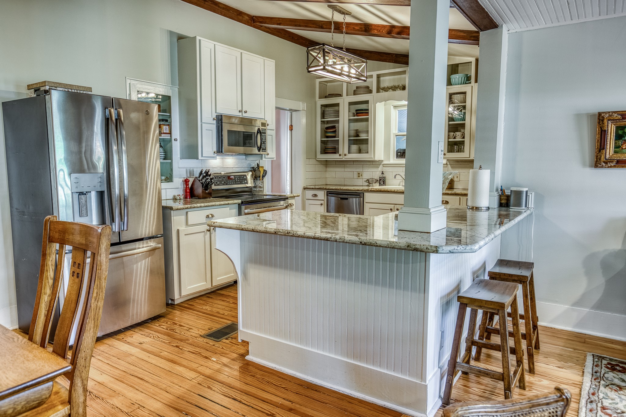 235 Hickory Road New Ulm, TX 78950 - Photo 20 of 43 a kitchen with stainless steel appliances granite countertop a refrigerator a stove and a wooden cabinets