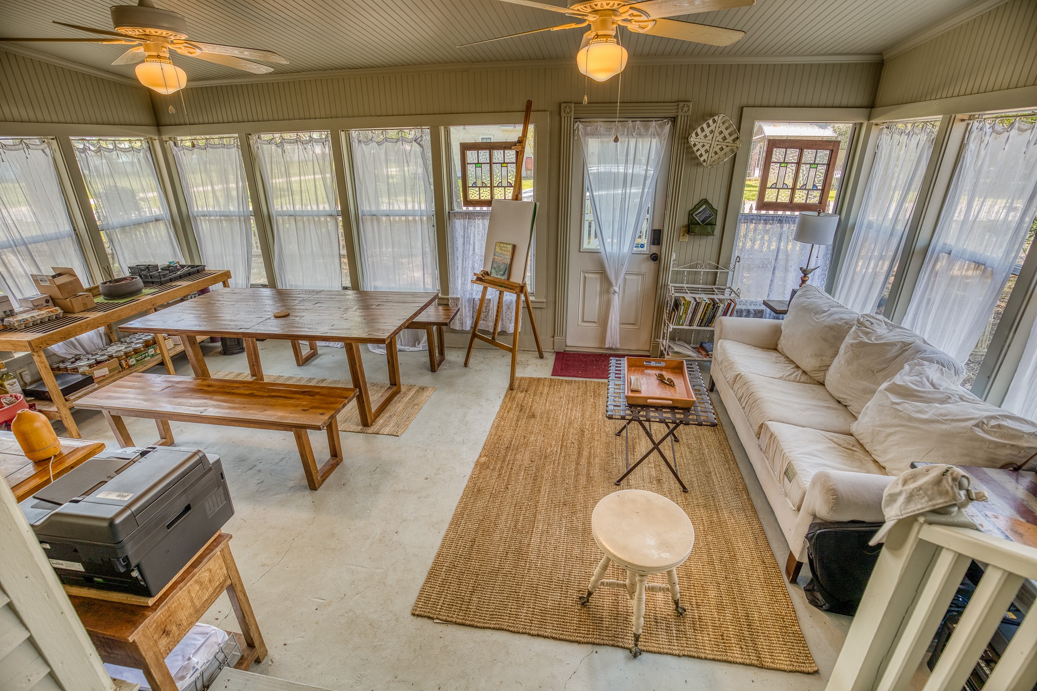 235 Hickory Road New Ulm, TX 78950 - Photo 35 of 43 a living room with furniture and a floor to ceiling window