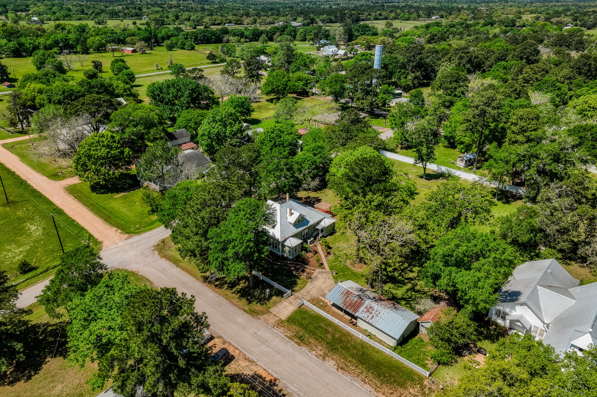 235 Hickory Road New Ulm, TX 78950 - Photo 37 of 43 an aerial view of residential house with outdoor space and trees all around