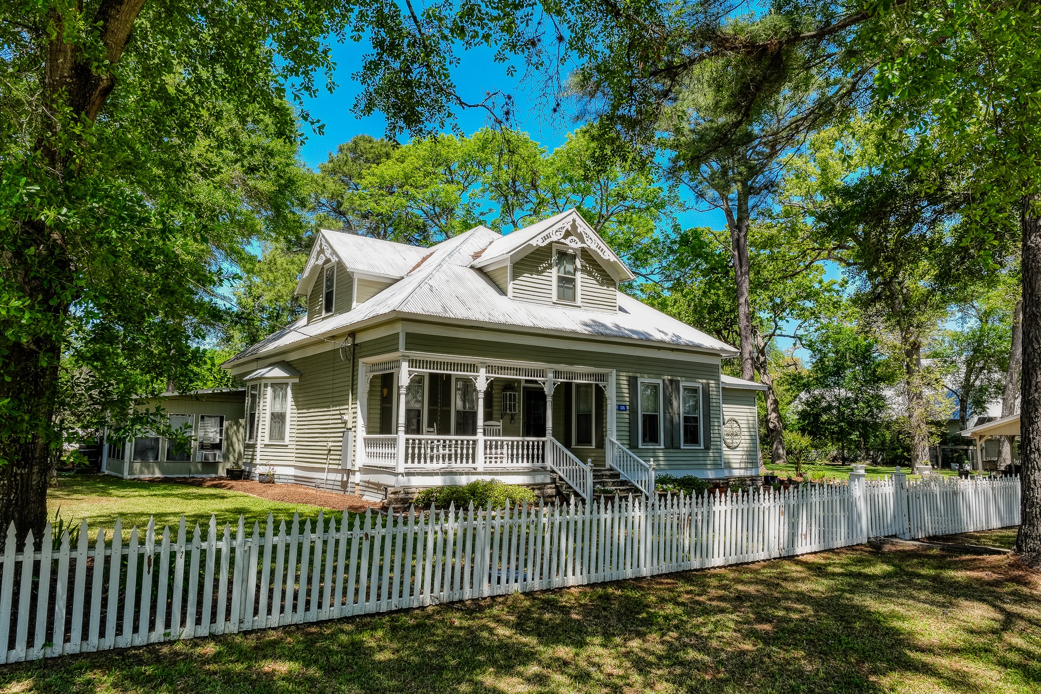 235 Hickory Road New Ulm, TX 78950 - Photo 6 of 43 a view of a house with a small yard and a large tree