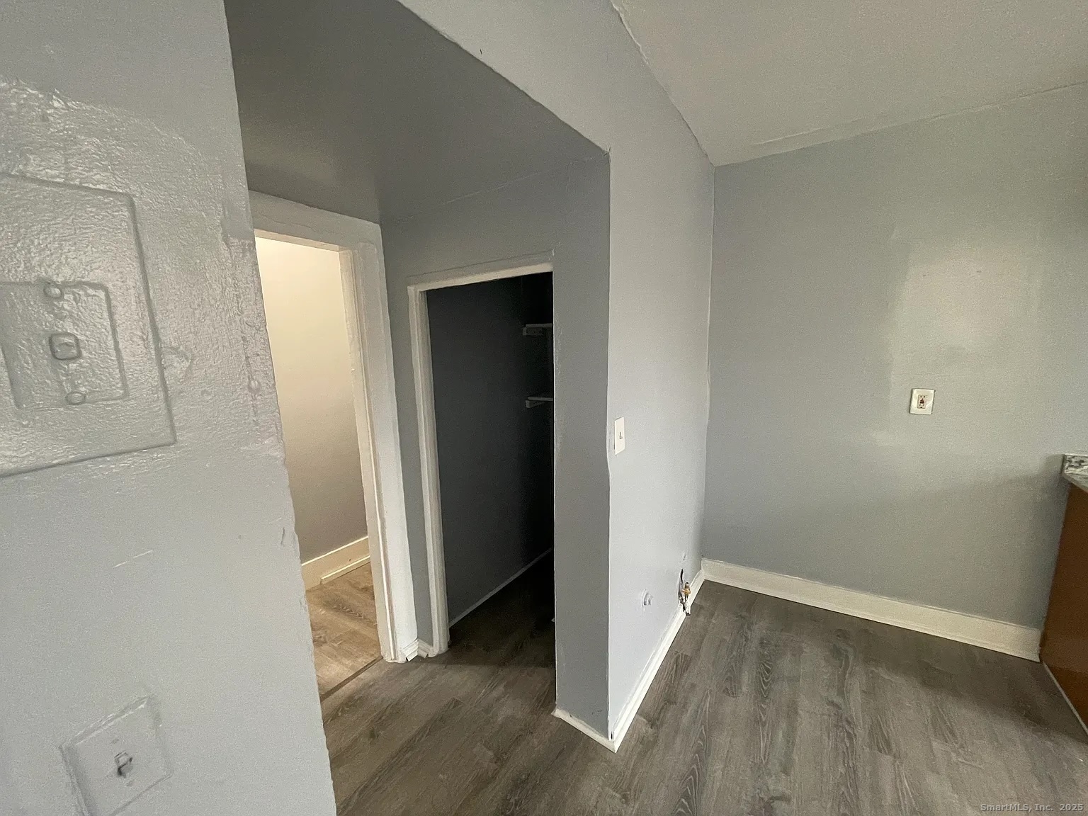 34 Park Street, Unit 1 Bridgeport, CT 06608 - Photo 5 of 8 an empty room with wooden floor and closet