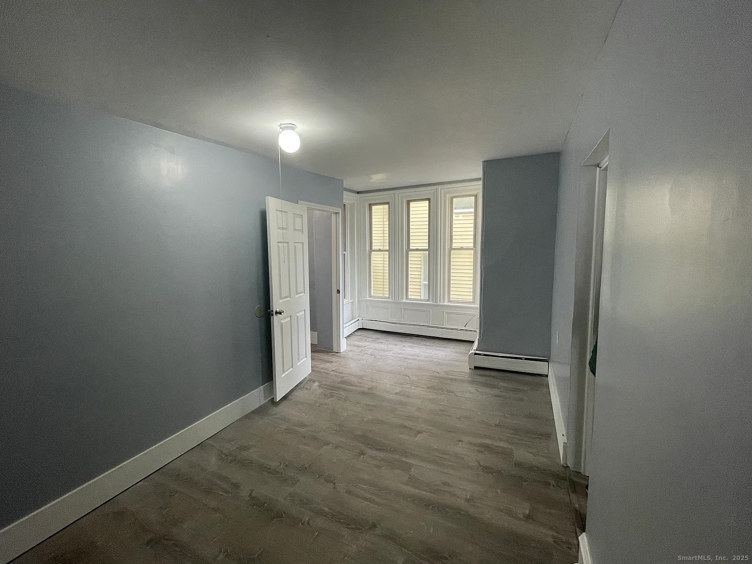 34 Park Street, Unit 1 Bridgeport, CT 06608 - Photo 6 of 8 an empty room with windows