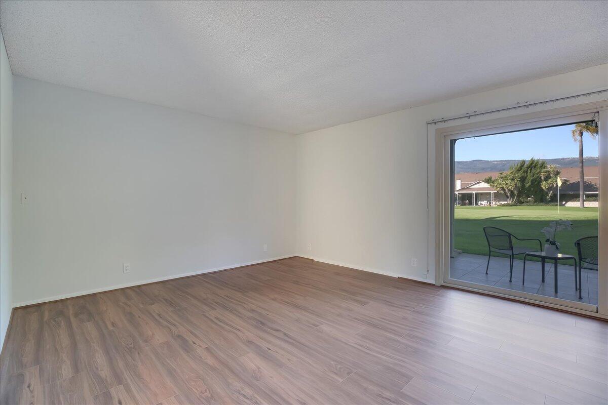 5910 Encina Road, Unit 3 Goleta, CA 93117 - Photo 14 of 45 a view of a room with wooden floor and outer view