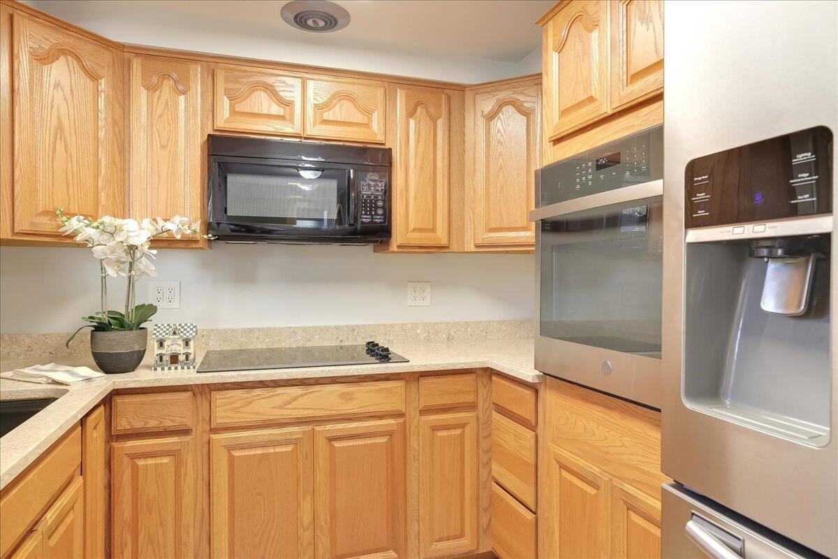 5910 Encina Road, Unit 3 Goleta, CA 93117 - Photo 17 of 45 a kitchen with stainless steel appliances a sink and a microwave