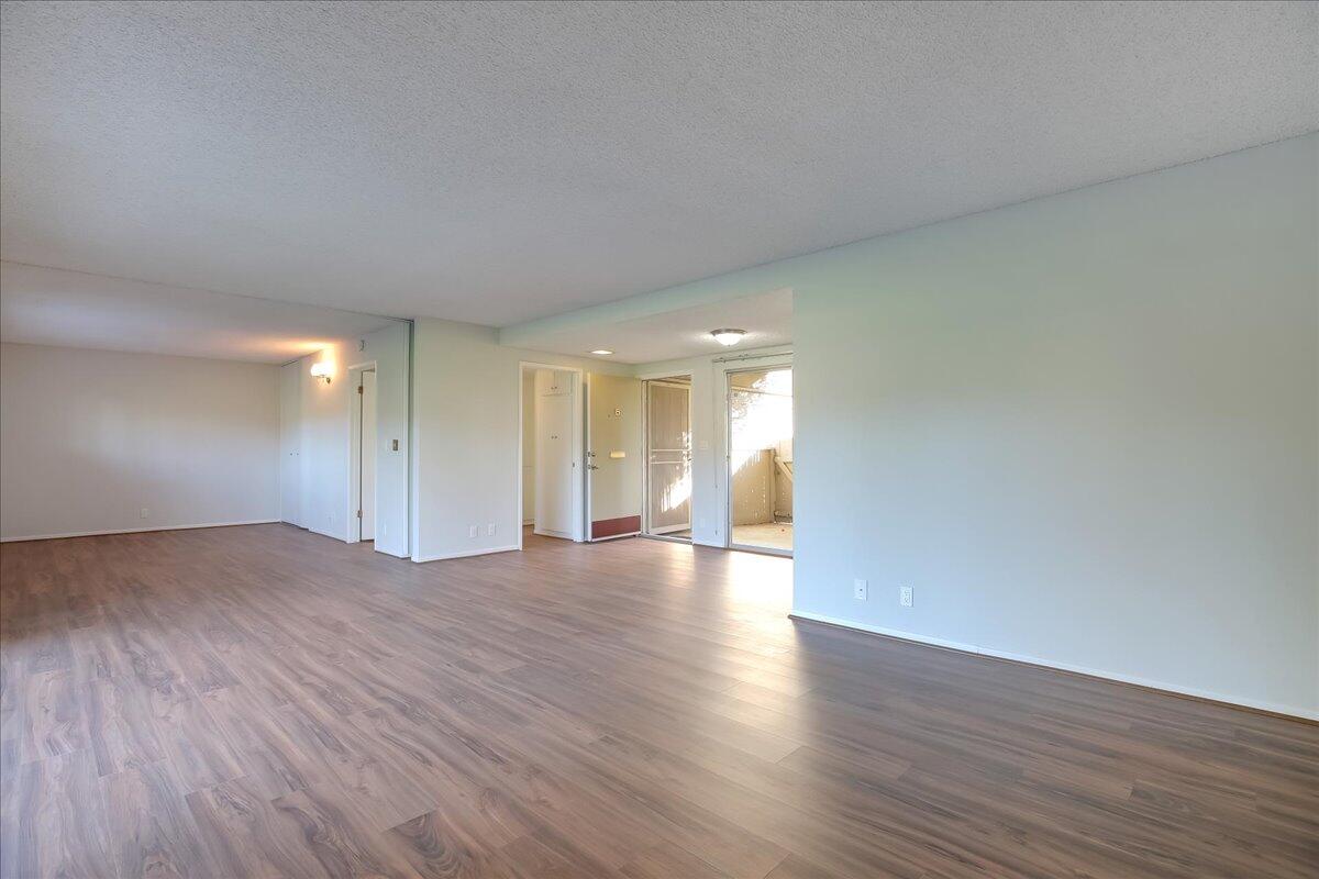 5910 Encina Road, Unit 3 Goleta, CA 93117 - Photo 18 of 45 a view of empty room with wooden floor