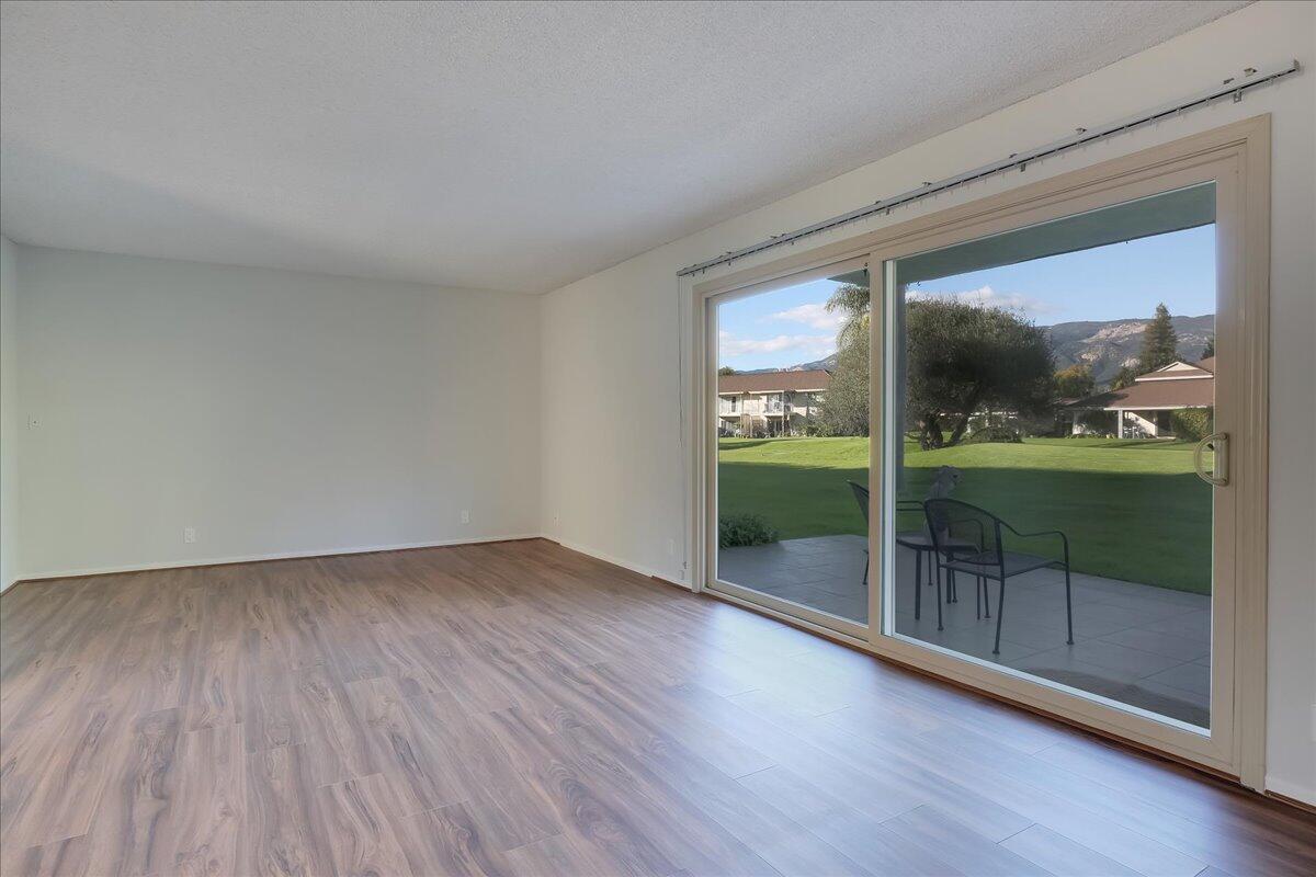 5910 Encina Road, Unit 3 Goleta, CA 93117 - Photo 19 of 45 wooden floor in an empty room with a window
