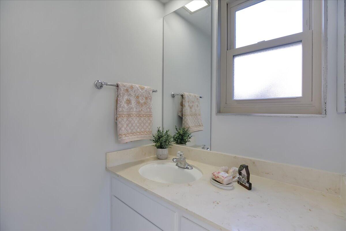 5910 Encina Road, Unit 3 Goleta, CA 93117 - Photo 27 of 45 a bathroom with a sink and a mirror