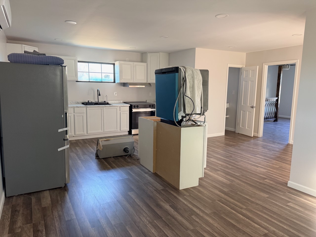 3512 Castor Street Houston, TX 77022 - Photo 16 of 24 a kitchen with stainless steel appliances a refrigerator and a wooden floor