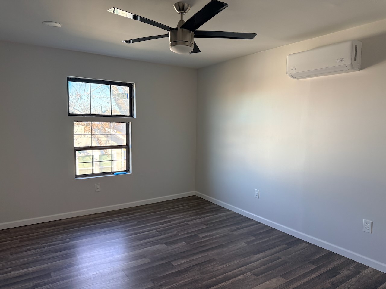3512 Castor Street Houston, TX 77022 - Photo 18 of 24 a view of an empty room with wooden floor and a window
