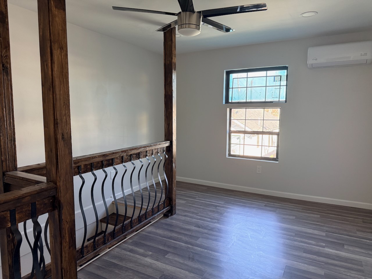 3512 Castor Street Houston, TX 77022 - Photo 19 of 24 a view of hallway with wooden floor and stairs